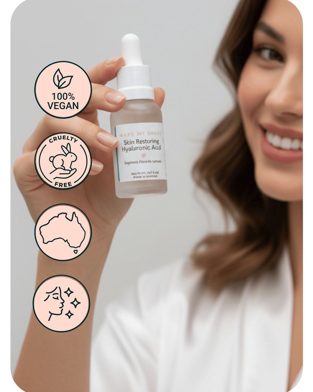 Woman holding a skincare dropper bottle with icons indicating vegan, cruelty-free, and Australian origin on a light grey background. Serum is Hyaluronic Acid by Make My Shave.