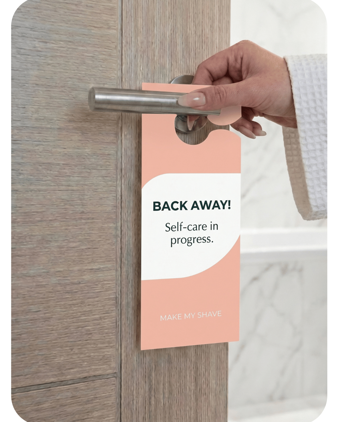 Hand holding a doorknob with a 'Back Away! Self-care in progress' sign attached to a wooden door.