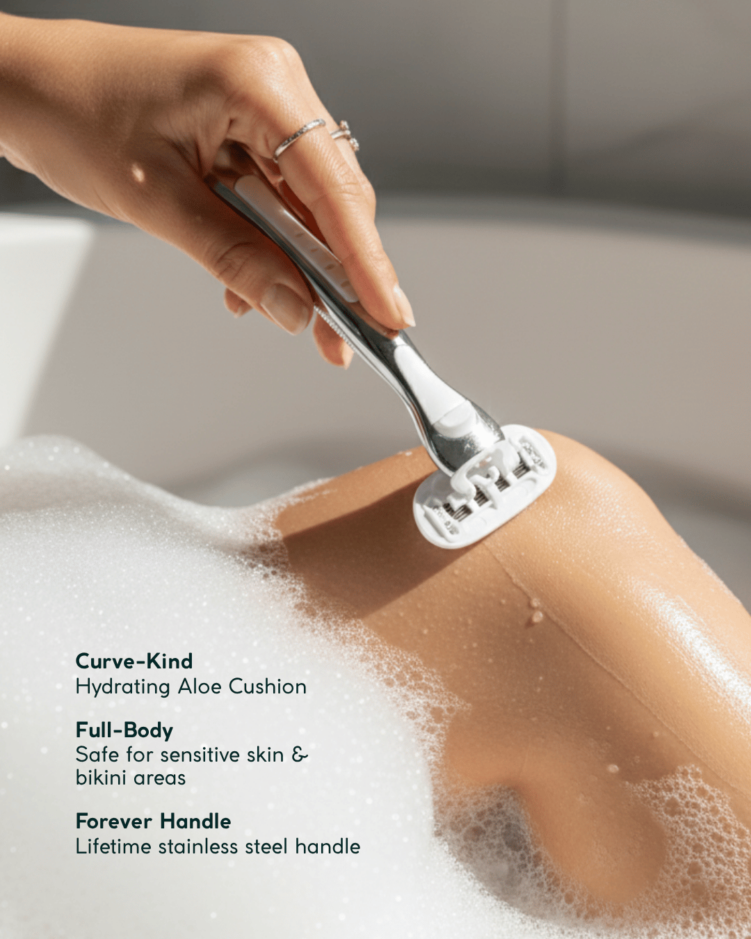 Woman in the bathtub using women's razor Australia to shave their leg with product features listed below.