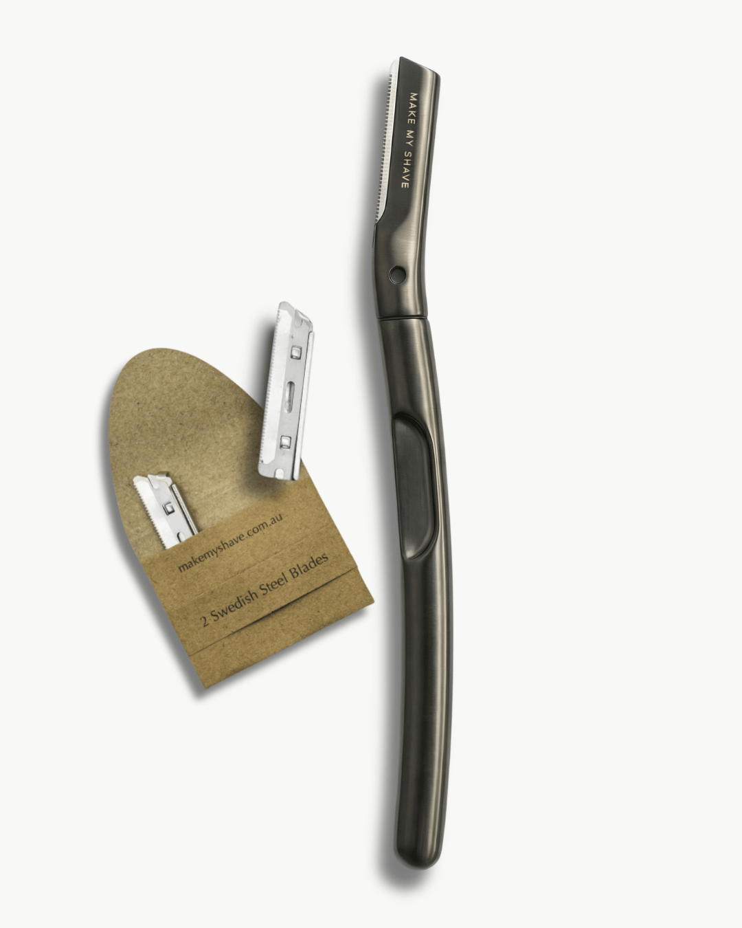 Metal Dermaplaning Tool in Black by Make My Shave, Australia. White background and two extra dermaplaning refill blades in eco-friendly packaging