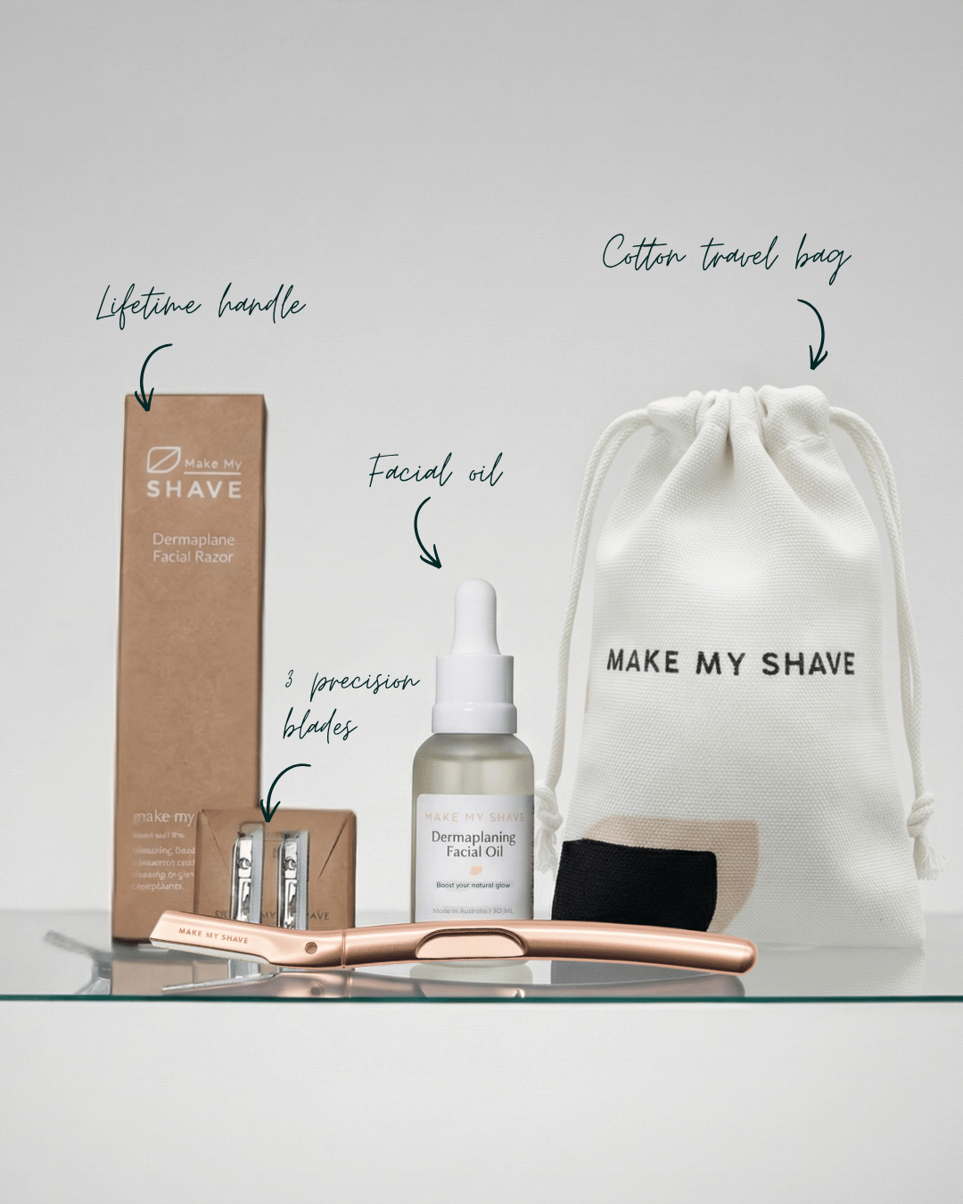Make My Shave's Dermaplaning kit with Dermaplaning facial oil, blades, and travel bag on a white background