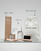 Make My Shave's Dermaplaning kit with Dermaplaning facial oil, blades, and travel bag on a white background