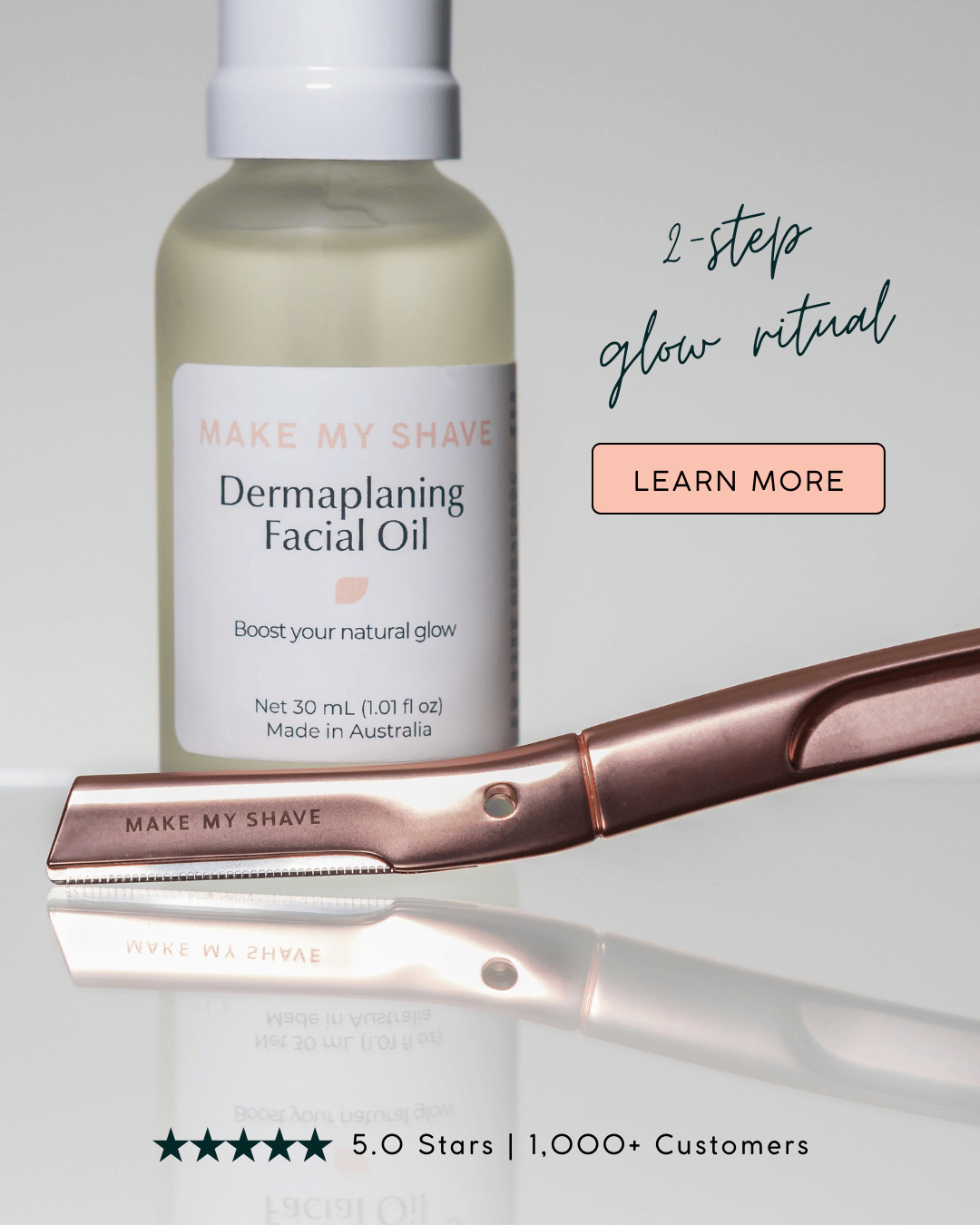 Make My Shave dermaplaning facial oil bottle and rose gold metal dermaplaner on a light grey background