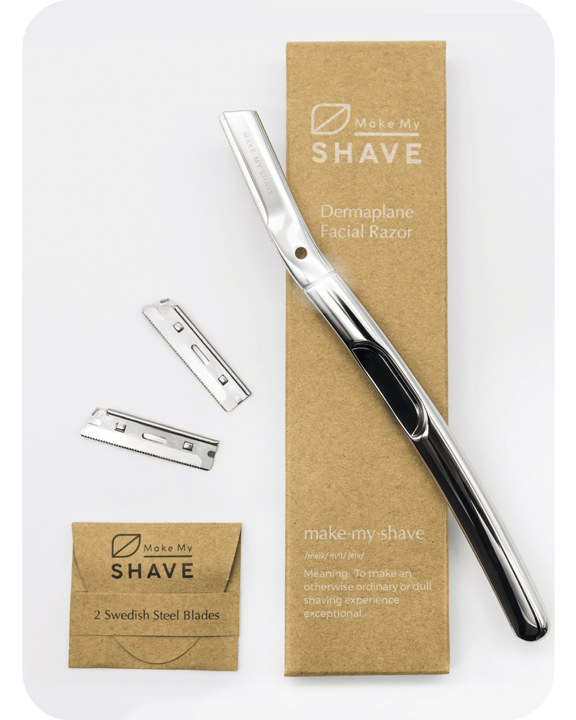 Metal dermaplaning tool with the Make My Shave logo. Metal dermaplaner with eco-friendly packaging finger divot. 